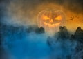 Spooky Halloween pumpkin in foggy mystical landscape