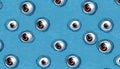 Spooky human eyes making pattern on blue Royalty Free Stock Photo