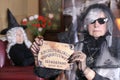 Spooky lady holding ouija board