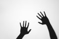 spooky mysterious shadows of human hands on grey Royalty Free Stock Photo