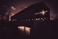 Spooky Sachs covered bridge in Gettysburg, PA in silhouette with a sunburst Royalty Free Stock Photo