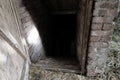 Spooky and Scary Dark Entrance to Food Basement of Barn in Countryside Royalty Free Stock Photo