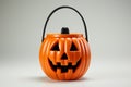 Spooky season ready Halloween pumpkin bucket against a white canvas