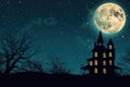 A spooky silhouette of a haunted house against a full moon in the night sky Halloween background with haunted house Royalty Free Stock Photo