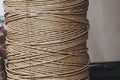 Spool of biodegradable natural beige linen thread Royalty Free Stock Photo