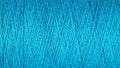 Spool of blue thread macro background Royalty Free Stock Photo