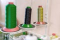 spool bobbins with thread for sewing clothes, industrial workshop sewing workshop, workplace of a tailor seamstress, professional