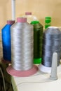 spool bobbins with thread for sewing clothes, industrial workshop sewing workshop, workplace of a tailor seamstress, professional