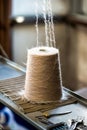 Spool of brown Thread on Industrial Sewing Machine