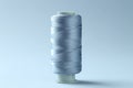 Spool of colorful sewing thread on light background Royalty Free Stock Photo