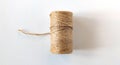 Spool of jute rope for whipping on a white background. Single thread Royalty Free Stock Photo