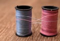 Spool of Pink and Blue Thread Intertwinning Royalty Free Stock Photo