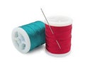 Spool of red and green thread with needle, Bobbins thread, Material of sewing tool, Cut out with clipping path Royalty Free Stock Photo