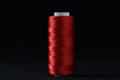 Spool of red sewing thread on black background Royalty Free Stock Photo