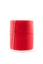 Spool of red thread and needle Royalty Free Stock Photo