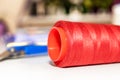 Spool of red thread on the table at the tailor Royalty Free Stock Photo