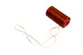 Spool of red waxed thread. Isolated background