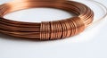 Spool of Shiny Copper Wire on White Backdrop, Close Up Royalty Free Stock Photo
