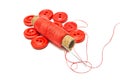 Spool of thread and buttons on white Royalty Free Stock Photo