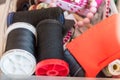 Spool of Thread and Needle, red spool of thread mounted on the sewing machine Royalty Free Stock Photo