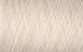 Spool of white thread macro background Royalty Free Stock Photo