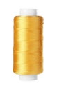 Spool of yellow sewing thread isolated
