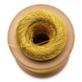 a spool of yellow thread on a wooden bobbin against a white background Royalty Free Stock Photo