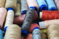 Spools of multi-colored threads lie in a box Royalty Free Stock Photo