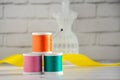 Spools of colored thread and miniature mannequin, hanger for sewing clothes. handicraft, handmade Royalty Free Stock Photo