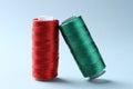 Spools of colorful sewing threads on light background Royalty Free Stock Photo