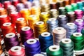 spools of colorful thread rolling in embroidery machine Royalty Free Stock Photo