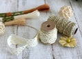 Spools with lace trim and baker`s twine. Laces and trims. Crafting and sewing supplies. Embroidery threads.