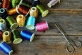 Spools of multicolored threads and scissors Royalty Free Stock Photo