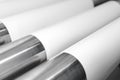 Spools of paper and metal rollers in print plant Royalty Free Stock Photo