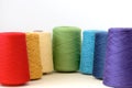 Spools of rainbow colors wool yarn for hand and machine knitting on a white background Royalty Free Stock Photo