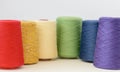 Spools of rainbow lgbt colors wool yarn for hand and machine knitting on a white background Royalty Free Stock Photo