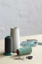 Spools of thead pins and measuring tape on table Royalty Free Stock Photo