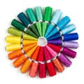 Spools of thread arranged in a circular pattern display a spectrum of colors Royalty Free Stock Photo