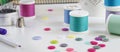 Spools of thread and basic sewing tools including pins, needle, a thimble and buttons. Long banner format Royalty Free Stock Photo