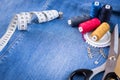 Spools Of Thread And Basic Sewing Tools On Jeans Cloth Top View. Royalty Free Stock Photo