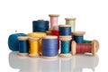 Spools of thread, bobbins with threads of different colors and sizes, cotton and synthetic threads for sewing, insulated on a whit Royalty Free Stock Photo