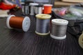 Spools of thread and close-up set of various fly tying accessories for fly fishing Royalty Free Stock Photo