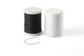 Thread spool on a white background. Basic color of thread: White, Black. Royalty Free Stock Photo