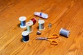 Spools of thread, thimbles, scissors and tape measure Royalty Free Stock Photo