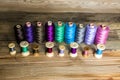 Spools of thread on wooden background. Old sewing accessories. c Royalty Free Stock Photo