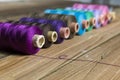 Spools of thread on wooden background. Old sewing accessories. c Royalty Free Stock Photo