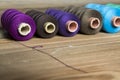 Spools of thread on wooden background. Old sewing accessories. c Royalty Free Stock Photo