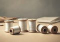 Spools of white thread arranged on a wooden surface for sewing projects Royalty Free Stock Photo