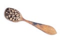 Spoon with allspice on white background Royalty Free Stock Photo