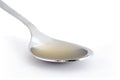 Spoon of apple cider vinegar Royalty Free Stock Photo